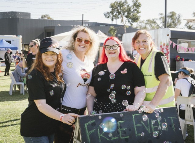 Four event attendees posing for a photo