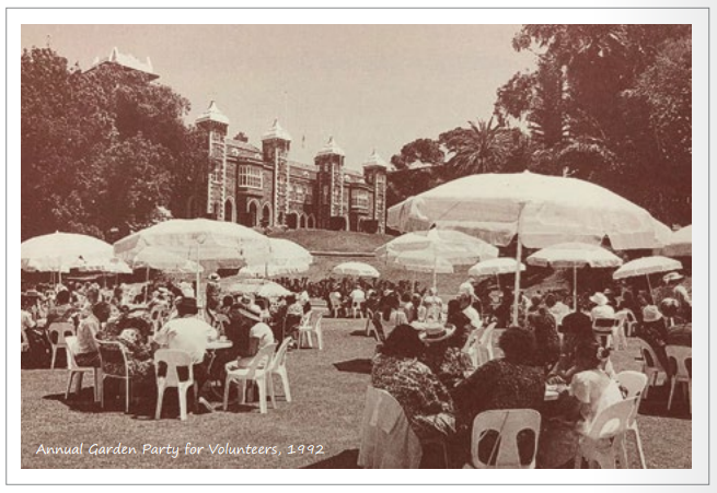 Sepia photograph of people at a garden party in 1992