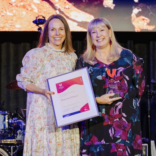 2025 Corporate Volunteering Award Winner, Horizon Power. receiving their award onstage