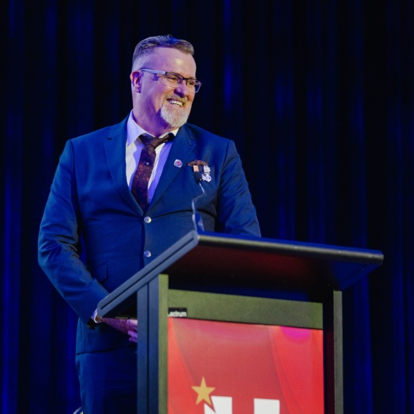 2025 RAC WA Volunteer of the Year Award winner, Brian Gallop ASM OStJ, giving a speech after winning his award