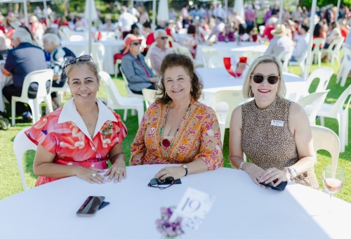 Three individuals seated at a table