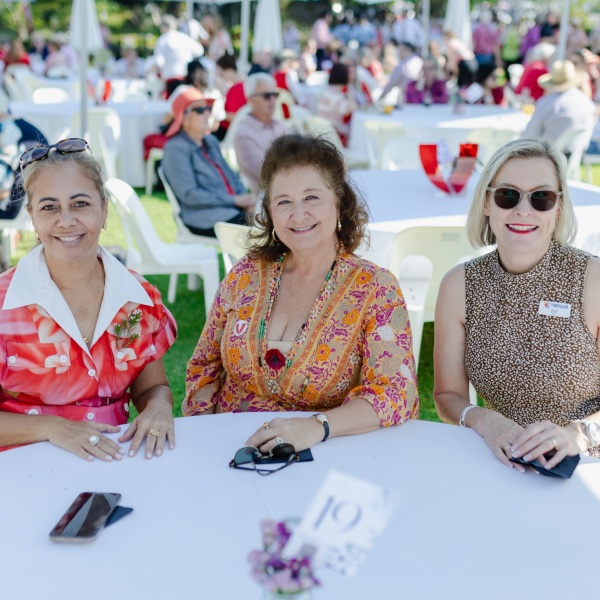Three individuals seated at a table