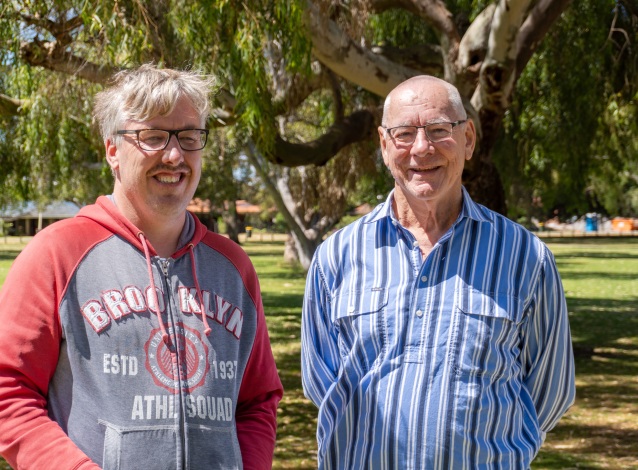 A volunteer with their client in the park